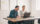 Zufriedene Geschäftsleute, die während eines Online-Meetings im Supply Chain Management Arbeitsalltag