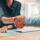 Handshake, deal and business people in office with agreement, contract or finance partnership. Meeting, welcome and financial advisor shaking hands with investor for investment negotiation at agency